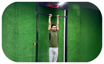 Viral 100-Second Hanging Challenge arcade machine rental for corporate events in Dubai, featuring a digital timer and participants testing their grip strength.